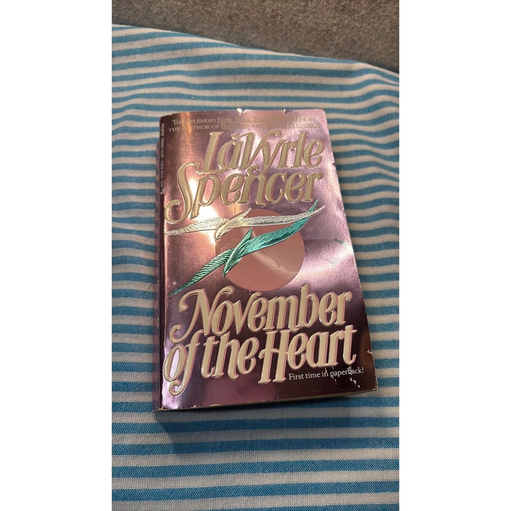 1994 paperback edition romance novel November of the Heart by LaVyrle Spencer